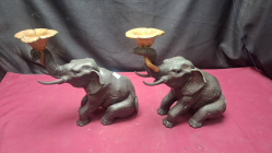 A pair of antique bronze elephant candle holders 