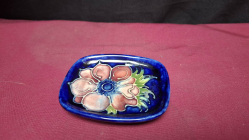 A lovely MOORCROFT pin tray in cobalt blue with anemone decoration