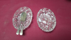 A pair of lead crystal butter dishes with two hallmarked 1904 Birmingham sterling silver
