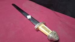  A vintage letter opener with ivorine and silver Celtic design handle
