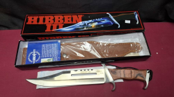 A RAMBO HIBBEN III Bowie knife with leather scabbard. Boxed as new