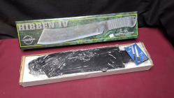 A RAMBO GIL HIBBEN IV movie prop Machete with leather scabbard. Boxed as new 