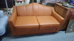 Vintage style two-seater orange sofa