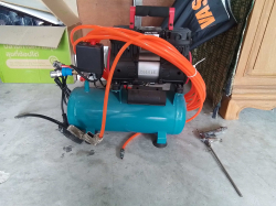 A Small compressed with attachments 