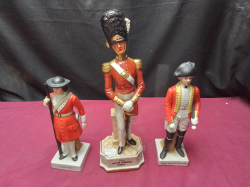 A Large Military figure 1840 Officer Grenadier Guards. W.10 cm H.32 cm included 2 smaller