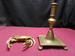 A crab brace Ashtray and a Brass Candlestick 
