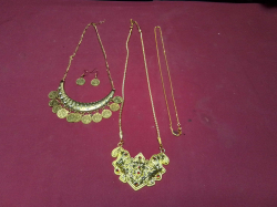 3 Ladies necklaces.one of them has earnings  