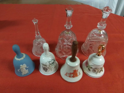 7 various handball including 2 large glass examples and a pale blue Wedgwood bell. Approx W.10 cm H.18 cm