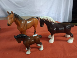 A large brown thoroughbred Horse by Beswick and 2 cart Horses. Large W.28 cm H.23 cm