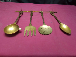 A Brass kitchen utensils with hanging hooks 