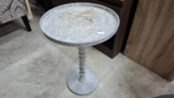 A Small round aluminuim side table. Face W.35 cm H. 52 cm
