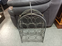 A Metal wine rack. 34 Cm width 50 Cm high 