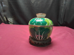 A Chinese pot with lid on stand 
