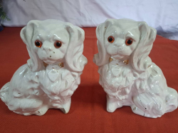 A Pair of old Spaniel dogs wit glass eyes. (A/F) W.28 cm H.20 cm