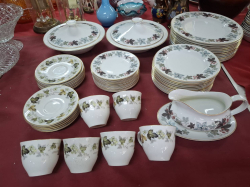 A Royal Doulton Camelot dinner set with 2 Tureens 20 plates 12 soups and 12 salad plates. Total 71 pieces