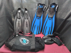 A pairs of diving flippers with a bag and shoes 