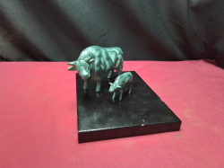 Cow and Calf Bronze Style , very heavy on stand .