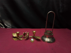 a pair of vintage solid brass candle holders Featuring a bird and leaf design included A vintage metal tea light holder with a Tall looped handle