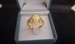 Beautiful gold plated ring with synthetic opal.