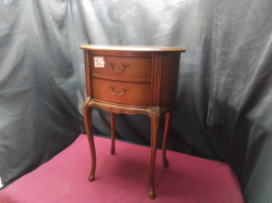 A Mid Century oval Cupboard on Queen ann legs 2drawers.
D31cm.
L42cm.
H59cm.