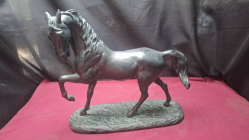 A horse sculpture on stand. Dimension H.41 cm W.15 cm L.40 cm