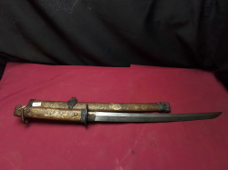 Beautiful samurai sword with embarrassed blade decorated with tiger