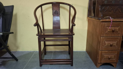 Antique Chinese hardwood horseshoe Huanghuali arm chair with woven rattan seat and carved back splat. Circa late 19th century/early 20th Century.