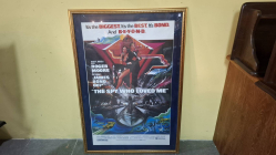 A framed and matted one sheet American James Bond art poster for the 1977 film 