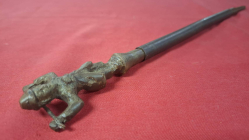 An antique Burmese bronze headed iron tattoo needle