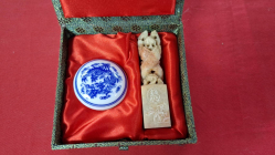 A boxed jade seal with blue and white china lidded ink container