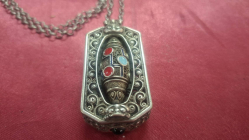 Tibetan or Himalayan-style rotating metal amulet pendant semi precious stones
