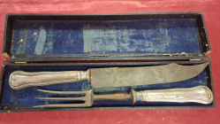 A Carving set wit silver handles