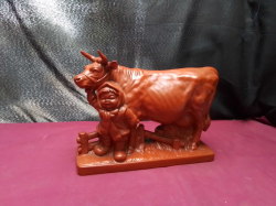 Vintage red clay ,Traditional Chinese village boy with milking cow 