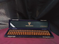 A vintage 1960s Japanese Tomoe Soroban Abacus ,very good condition in original case,from a school
W8cm. L35cm.