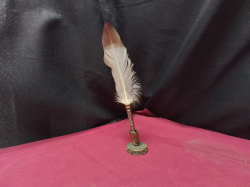 1950s Calligraphy feather quill dip pen with a engraved metal barrel and desk stand the pen holder has a fleur de lys near the base
