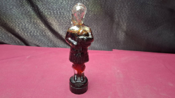 Antique glass bottle shaped Scottish solider playing the bagpipes 
H18cm. W5cm.