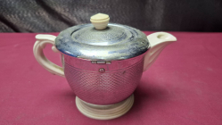 A Heatmaster Chrome &Ceramic Teapot 
H9cm. W8cm