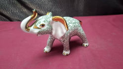 Fitz and Floyd Porcelain elephant figurine with green fishnet pattern
H12cm. W15cm.