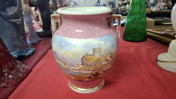 Hand painted porcelain vase with two handles. 