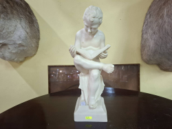 A Small Fibre stone of a boy Reading D13cm. W11cm. H37cm.