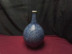 A Japanese Ko-Imari style Tokkuri (sake bottle)mijin  -karakusa 18th-19th century 
H35cm. W20cm.