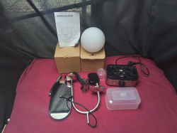 An Electric egg cooker and a Electric 2 brand light 