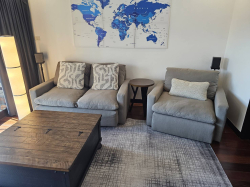 A very comfortable grey fabric 2 seater Settee and armchair