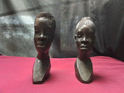 A male and female pair of Hand Carved African head 
H20cm. W10cm.