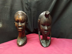 A Heavy male and female hand carved wooden African head 
H25cm. W11cm.