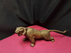 bronze colored cast iron tiger 
H13cm. W20cm.