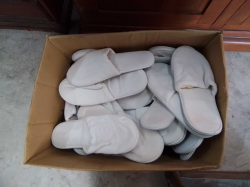 full box  of bathroom slippers 