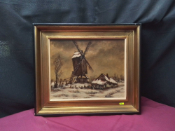 An Oil on Board of A windmill in snow signed 
W38cm.L44cm.
