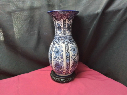 A Lovely blue and white Delft vase on a wooden stand 
H36cm.W13cm.