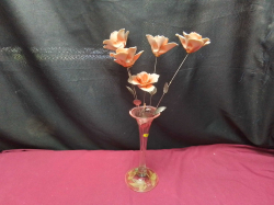 A spill vase with  ceramic flowers .
H21cm. 